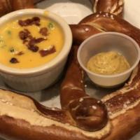 Big Daddy Pretzel · With bacon cheese dip and mustard.