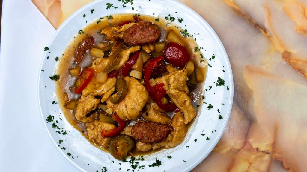 Chicken Scarpariello · Morsels of boneless chicken with Italian sausage, hot or sweet cherry peppers in a garlic wine sauce.
