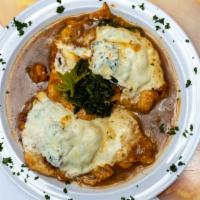 Chicken Saltimbocca · Chicken breast topped with prosciutto, spinach, mozzarella cheese in a brown sauce.