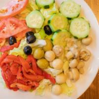 Garden Salad · Iceberg lettuce, tomatoes, cucumbers, peppers and black olives.