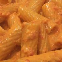 Rigatoni Alla Vodka · Onions, prosciutto and pink cream sauce.