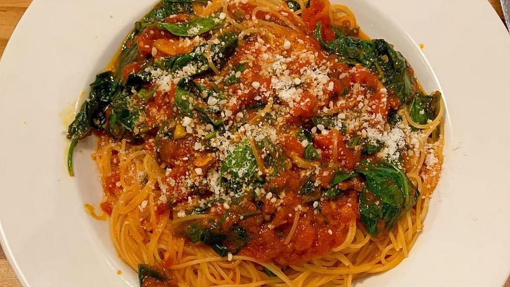 Pasta Spinaci · Fresh spinach, filetto di pomodoro sauce and garlic.