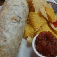 Veggie Burrito · Served with rice, beans, lettuce, tomatoes, Jack and Cheddar cheese, sour cream, and homemad...