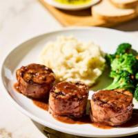 New!  Prosciutto-Wrapped Pork Tenderloin · Medallions wood-grilled with
Mr. C’s Grill Baste, olive oil and herbs, topped with a port wi...
