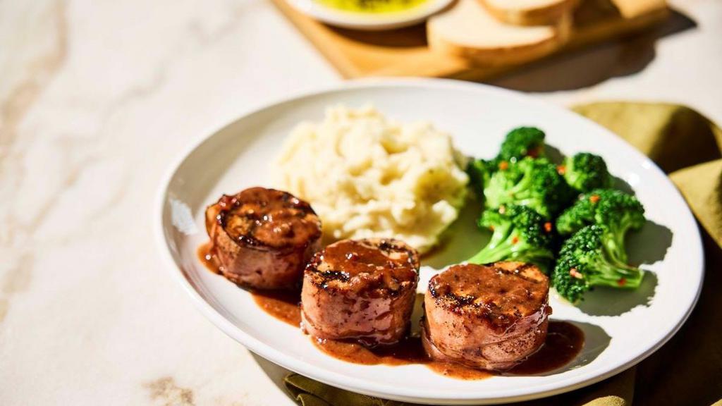 New!  Prosciutto-Wrapped Pork Tenderloin · Medallions wood-grilled with
Mr. C’s Grill Baste, olive oil and herbs, topped with a port wine fig demi sauce. Served with choice of soup or salad and two freshly made sides.