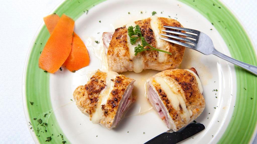 Chicken Cordon Bleu · Chicken stuffed with ham & swiss served with potato and vegetable.