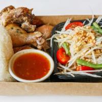 Huge Gai Yang Som Tum · Grilled marinated half chicken serve with papaya salad , sticky rice and spicy tamarind sauc...