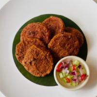 Tod Mun Pla · Spicy. Homemade spicy fried fish cake and long bean serve with cucumber relish.