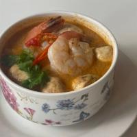 Tom Yum Soup · Spicy.  White mushroom, scallion, and cilantro in sour and spicy soup.