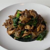 Pad See-Ew · broad noodles, Chinese broccoli, and fried egg with thick soy sauce.