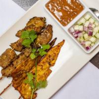 Satay · Strips of grilled marinated chicken or beef on skewers peanut sauce, cucumber salad.