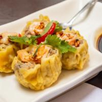 Kanom Jeeb · Steamed thai dumpling, minced pork, shrimp, mushroom, soy vinaigrette dip.