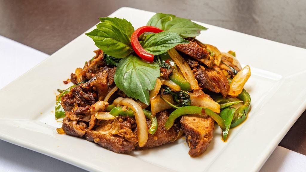 Petd Kraprow · Hot. Sliced crispy duck, basil leaves, onion, bell and chili peppers, fried.