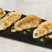 Pan-Seared Potstickers · 6 Steamed, pan-seared pork dumplings with Szechuan dipping sauce.