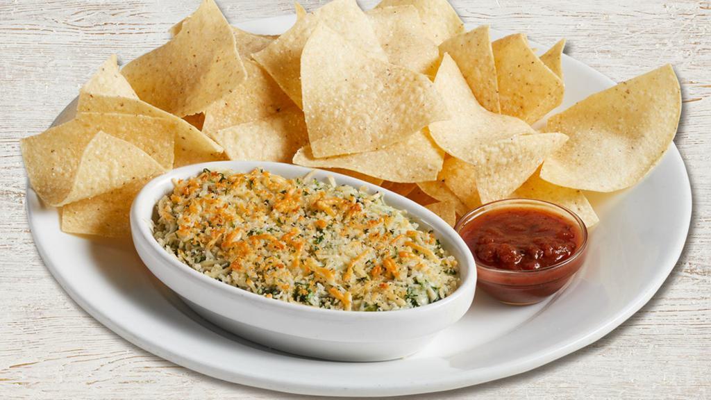 Spinach & Artichoke Dip · Fresh spinach, artichokes, Romano, sautéed onions, and red bell peppers. Topped with Parmesan bread crumbs and served with tortilla chips and salsa. 720 cal.