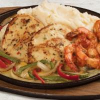 Sizzling Chicken & Shrimp · Garlic-marinated chicken breasts with shrimp tossed in marinara. Served over melted cheese w...