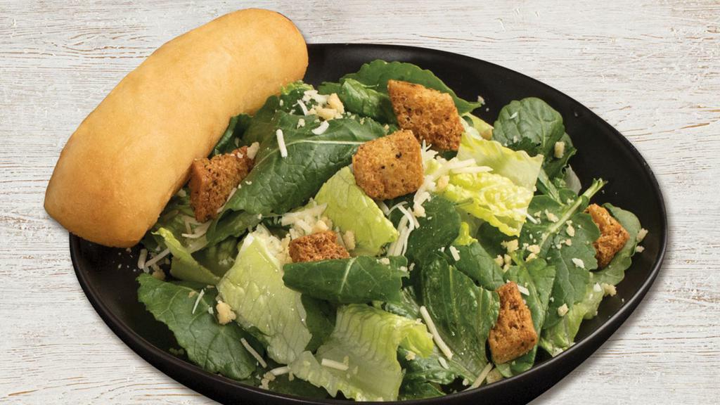 Caesar Salad · Romain, Parmesan, Romano, Caesar dressing, Asiago croutons and Parmesan crisps.  Served with a warm garlic breadstick and Caesar dressing on the side.