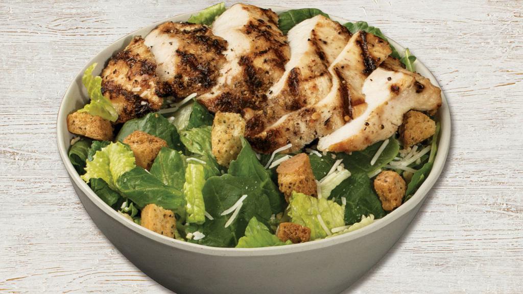Caesar Salad With Grilled Chicken · Grilled chicken, romaine, Parmesan-Romano, caesar dressing, Asiago croutons, and Parmesan crisps. 780 cal.