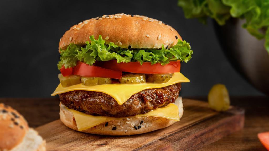 Gourmet Cheeseburger · 100% beef patty topped with lettuce, tomato, onions and cheese.