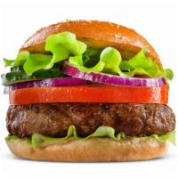 The Hamburger · Juicy beef patty, lettuce, tomatoes on a fresh bun.