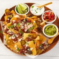 Nachos · Add chicken or steak for an additional charge.