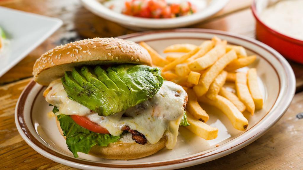 Chipotle Grilled Chicken Sandwich · Grilled chicken breast with grilled red onions, sliced avocado, lettuce, tomato, pepper jack cheese and topped with chipotle mayonnaise. Served with French fries.