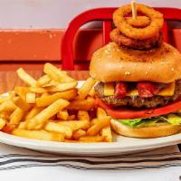 10 Oz. The Fiesta Burger · Burger loaded with onion rings and chorizo, lettuce and tomato. Served with French fries.