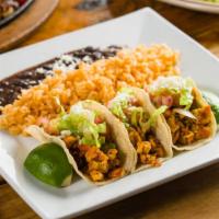 Grilled Chicken Tacos · Guacamole, lettuce, pico de gallo, queso fresco and two salsas. Served with rice and beans g...