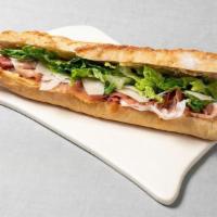 Prosciutto Manchego Baguette · with dried figs and mustard butter on a baguette