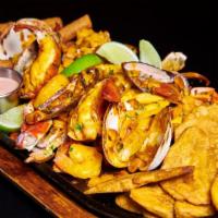 Parrillada De Mariscos · Grilled Seafood Platter: Langosta, Calamares, Camarones, Mejillones. Almejas y Pasta de Cang...