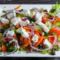 Greek Salad · Tomatoes cucumbers onions olives and feta cheese in an olive oil dressing.