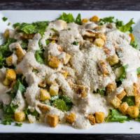 Caesar Salad · Creamy caesar dressing and flavorful croutons to please the entire crowd.
