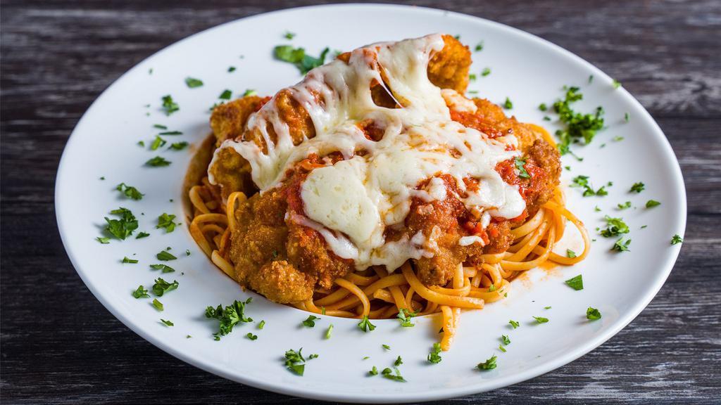 Chicken Parmigiana · Fried boneless chicken breast with sauce topped with fresh mozzarella. served with side of pasta or vegetables.