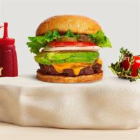 Avocado Vacancy Burger · Seasoned plant-based patty topped with avocado, melted vegan cheese, lettuce, tomato, onion,...