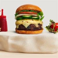 Jalapeno Translation Vegan Burger · Seasoned plant-based patty topped with melted vegan cheese, jalapenos, lettuce, tomato, onio...
