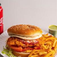 Spicy Chicken Sandwich · W. Fries & can of soda.