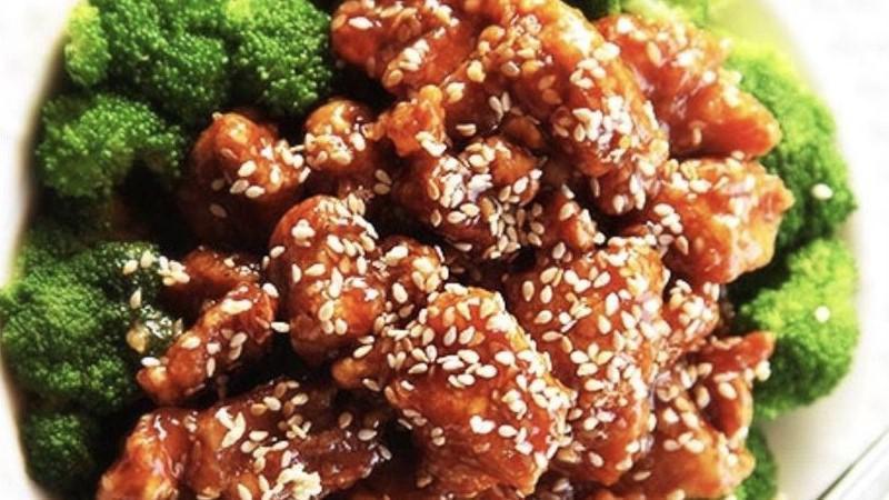 Sesame Chicken Combination Plate · Served with egg roll and pork fried rice.