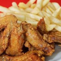 Chicken Wings Lunch Special · Served with choice of egg roll, spring roll, soup or can of soda and choice of rice.