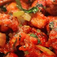 Chicken 65 · Tender chicken marinated and cooked with curry leaves, mustard and chili pepper.