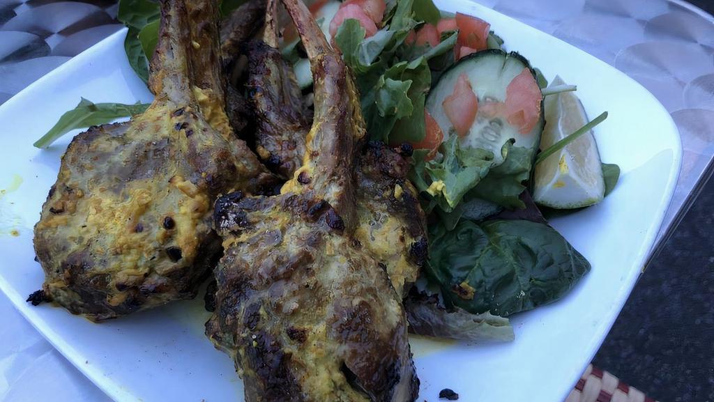 Lamb Chops · Rack of lamb marinated in a paste of fresh mint, coriander, garlic, ginger and ground peppercorns, cooked in a tandoor.