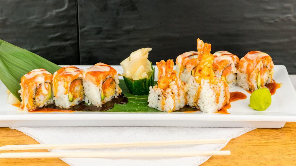 Muscle Beach · Tempura Shrimp, spicy tuna, and avocado topped with snow crab mix, chef sauce, and eel sauce.