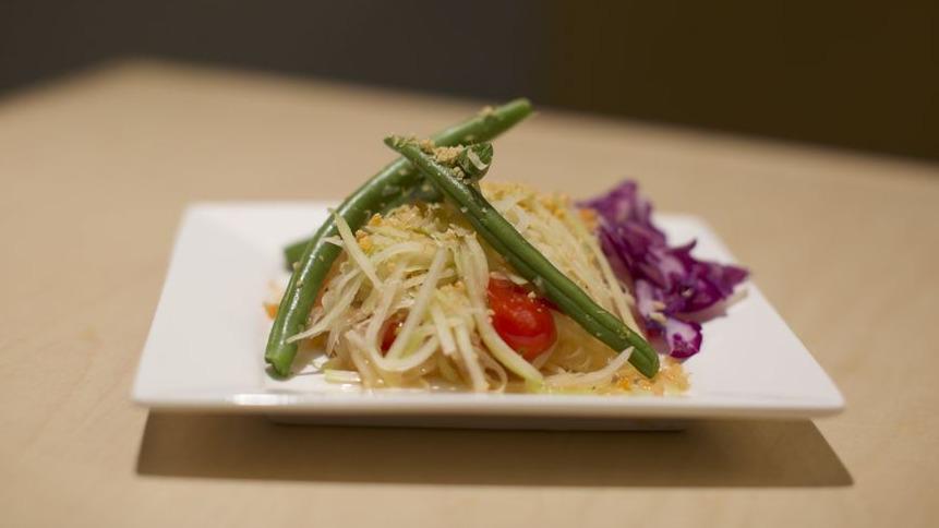 Green Papaya Salad · Green papaya, tomato, garlic, chili, dried shrimp, and long bean. Tossed in nuoc mam vinaigrette and topped with roasted peanuts.