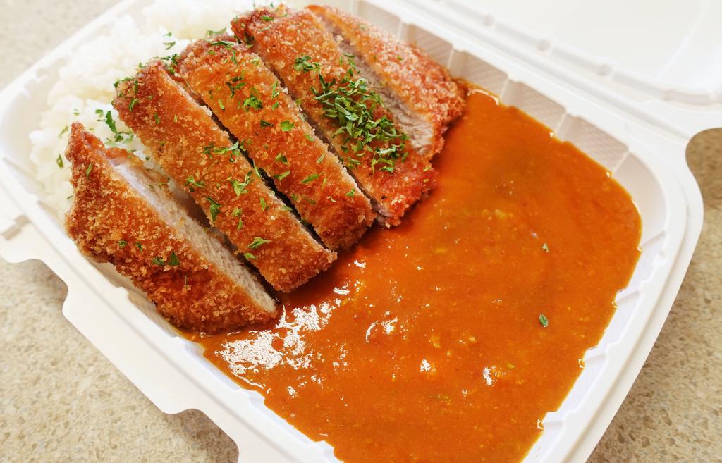 Katsu Curry Rice Plate · Our house made tomato based curry with crispy katsu. Choice of  Chicken katsu or Tonkatsu and white rice.
Curry comes in a different container.