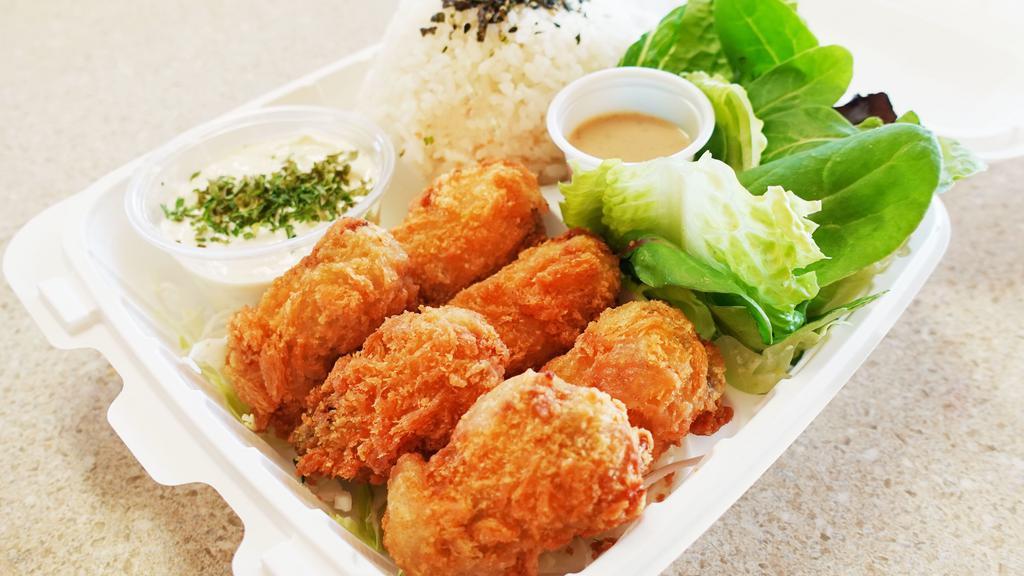 Oyster Katsu Plate · 6 pieces of fried breaded oyster katsu (Cutlet) with fresh tossed salad and furikake rice. Comes with house made Tartar sauce or Katsu Sauce and dressing on the side.