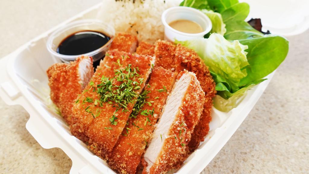 Tonkatsu Plate · Tonkatsu (Pork cutlet) with fresh tossed salad and furikake rice.  Comes with house made Katsu sauce and a dressing on the side.