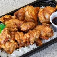 Mochiko Chicken Bento · Mochiko chicken on a bed of furikake rice or tossed salad. Comes with house made BBQ (Japane...