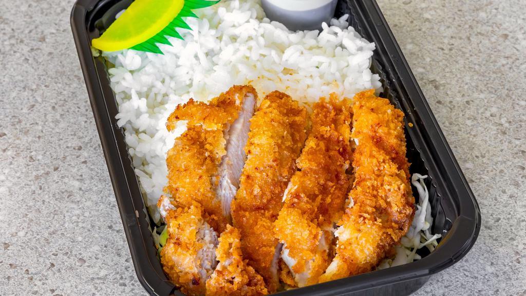 Chicken Katsu Bento · Crispy boneless Chicken Katsu (Cutlet) on a bed of rice or tossed salad. Comes with house made Katsu sauce in a container.