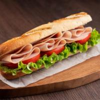 Caprese Sandwich · Delicious sandwich made with fresh baguette, mozzarella cheese, basil pesto, arugula, dried ...