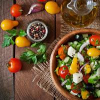 Greek Salad · Delicious Romaine Lettuce Salad with Onion, Chopped Tomato, Cucumber, Pepperoncini, Feta, Gr...