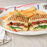 Mediterranean Panini · Grilled chicken breast with grilled mushrooms, sundried tomatoes, fresh spinach and mozzarel...